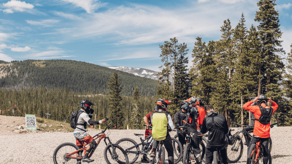 A group of mountain bikers on a dirt road.