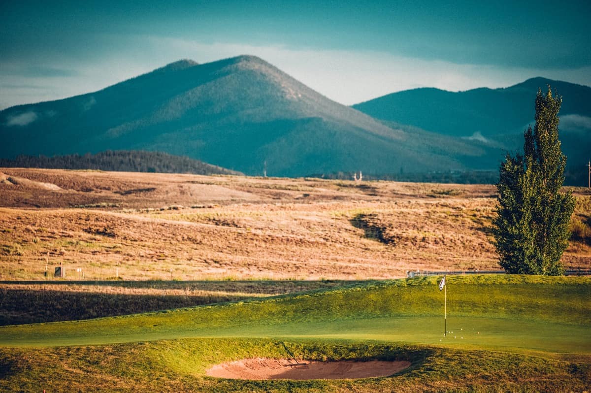 Mountains behind the green, seen from the Grille at Grand Elk at the Grand Elk Golf Club