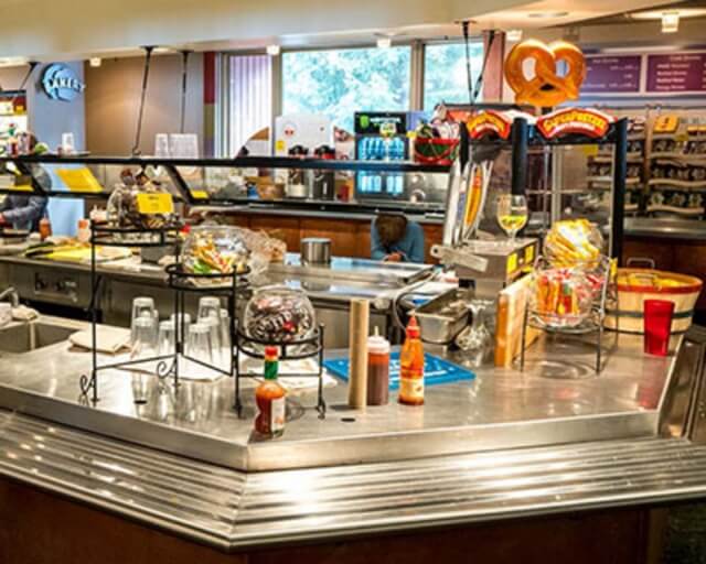 A bustling cafeteria counter with a variety of food and drink options in Grand County Colorado.
