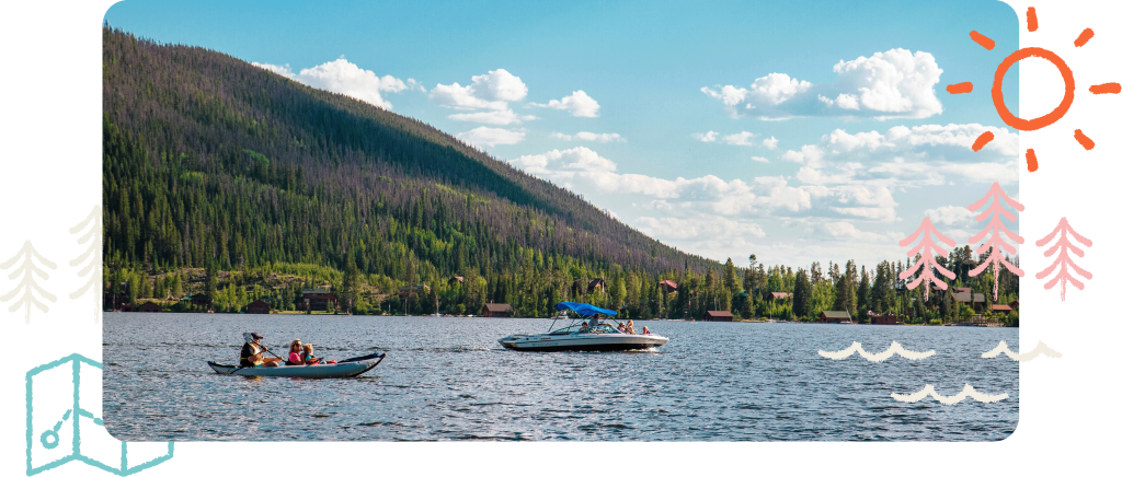 Groups of people kayaking and boating on Grand Lake, surrounded by tree-covered landscapes and mountains.