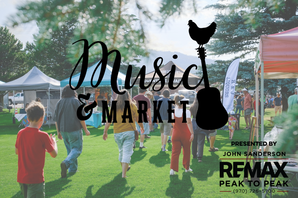 A lively outdoor music and market event with tents, people, and a guitar silhouette in Grand County Colorado.
