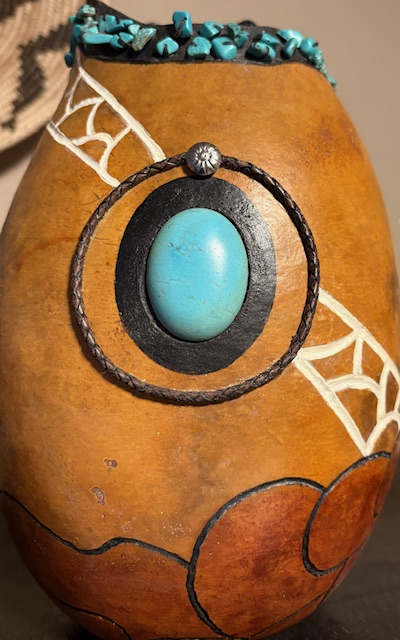 A intricately decorated gourd with turquoise inlay and beadwork in Grand County Colorado.