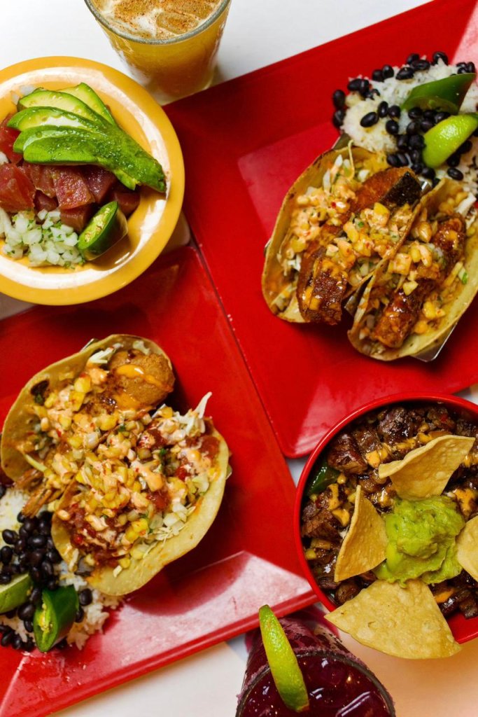 A top-down view of various Mexican-inspired dishes including tacos, poke, and a burrito bowl in Grand County Colorado.
